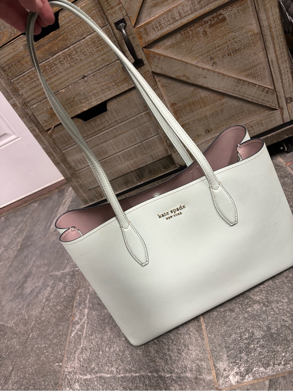 kate spade mint green tote with pink interior and gold logo